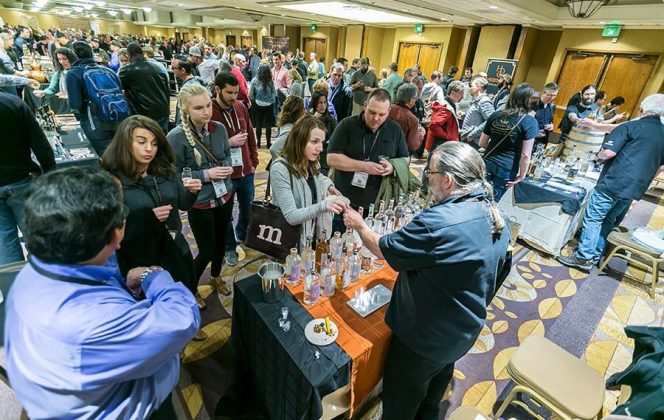 Distiller Rick Rickard of Rolling River Spirits dispenses samples of his spirits at the opening night reception and tasting at the DoubleTree Portland.